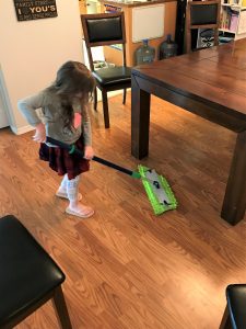 child completing her morning high five chores