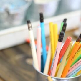 coloured pencils in tin